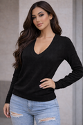 Unleash your edge with this long-sleeve V-neck top that commands attention. The structured  