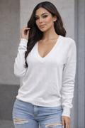 Unleash your edge with this long-sleeve V-neck top that commands attention. The structured  