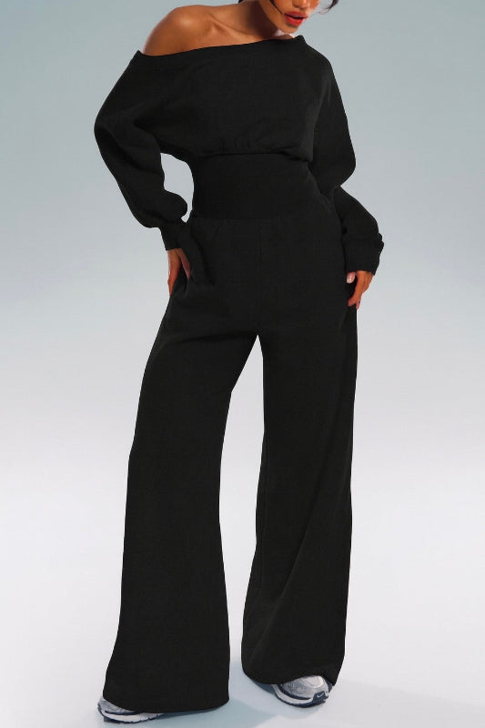 Slip into effortless sophistication with the Midnight Flow Jumpsuit. This bold one-piece silhouette