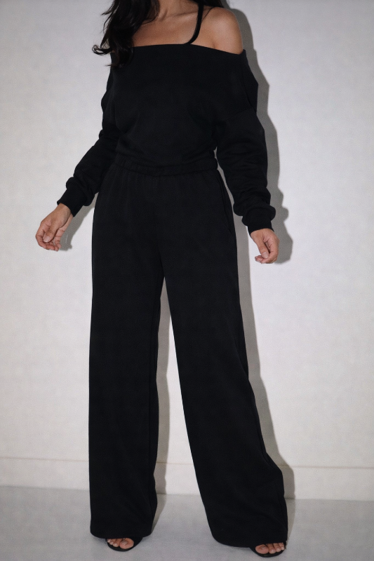 Slip into effortless sophistication with the Midnight Flow Jumpsuit. This bold one-piece silhouette 