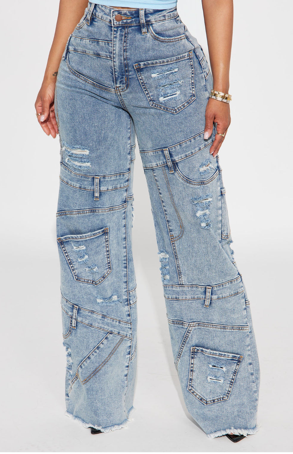 Elevate your style with High Rise Mixed Panel Jeans. Get the look you want in this versatile piece. 