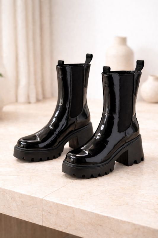  Step into style with these sophisticated boots, featuring a durable lug sole for enhanced traction 